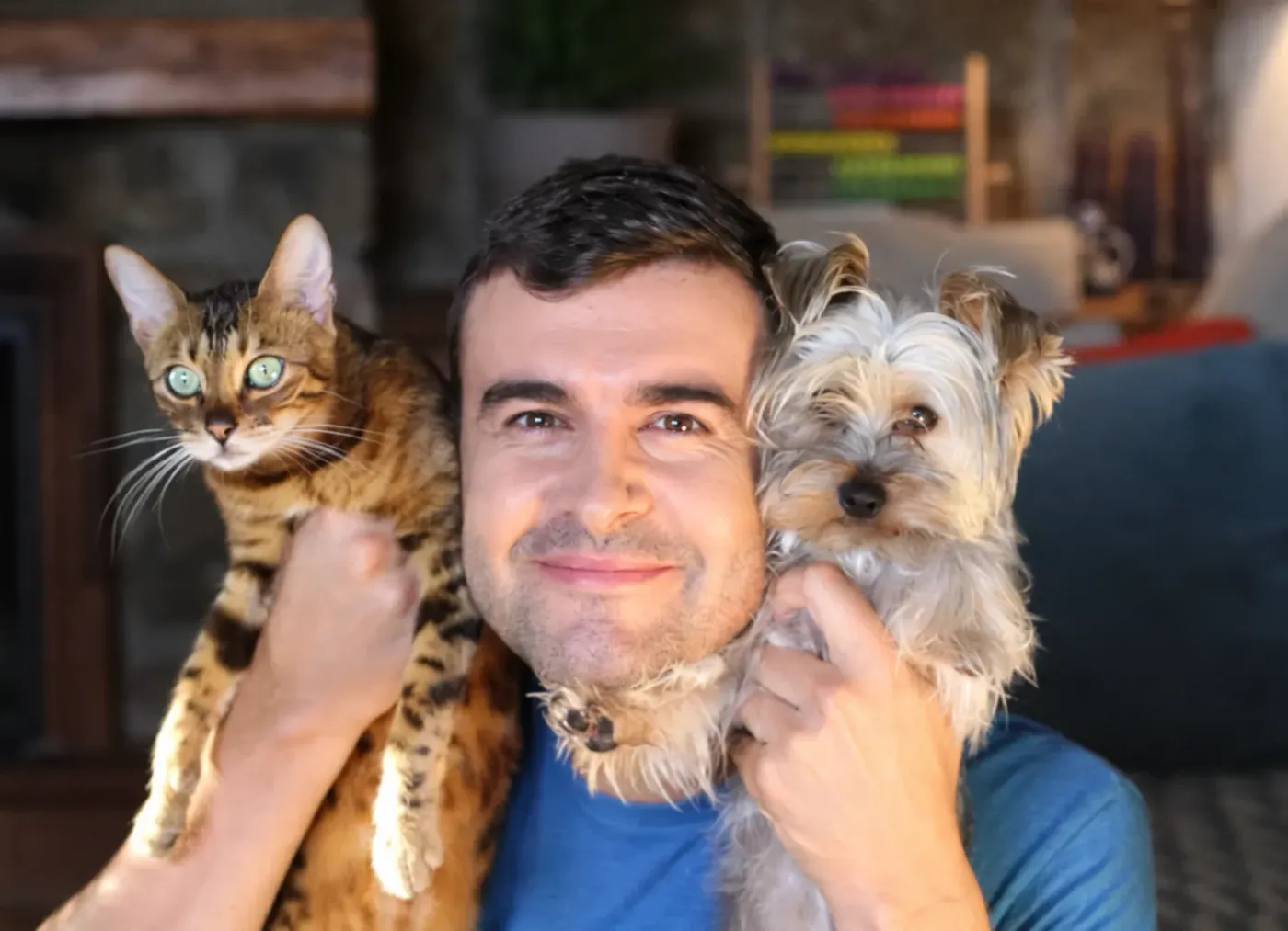 Man holding emotional support animals &mdash; Bengal cat and small dog